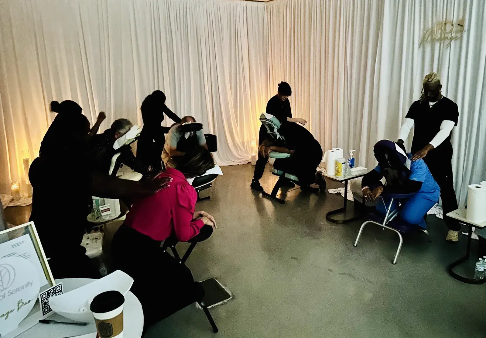 Peace of Serenity therapists giving chair massages to guests at an event
